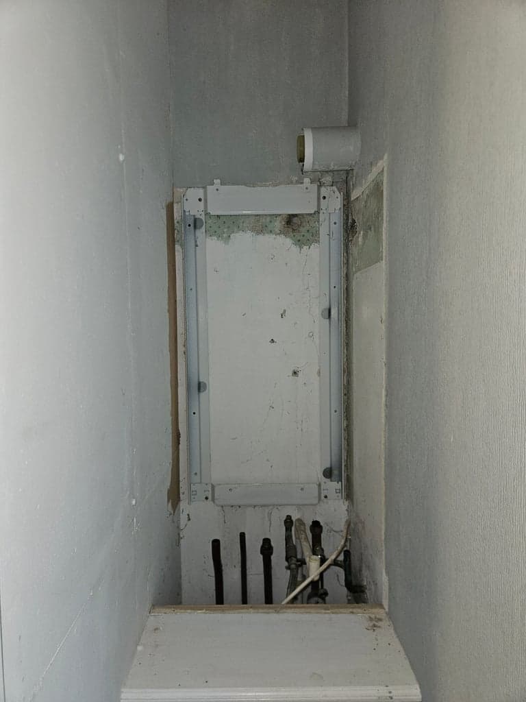 Old boiler removed during boiler replacement in Galmpton