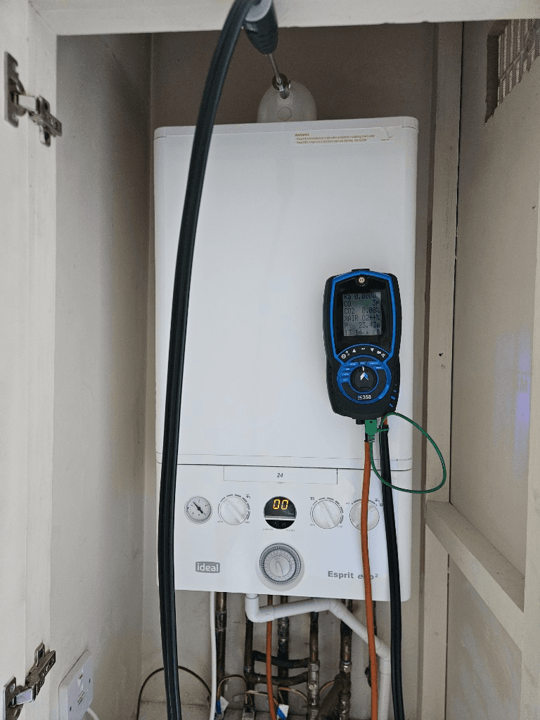 Bay Plumbing and Heating engineer carrying out an annual boiler service in Paignton