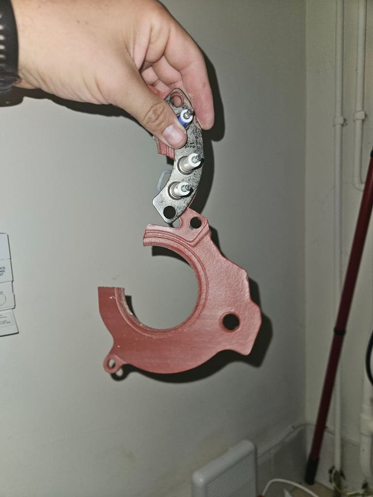 Damaged burner seal removed during boiler repair in Newton Abbot