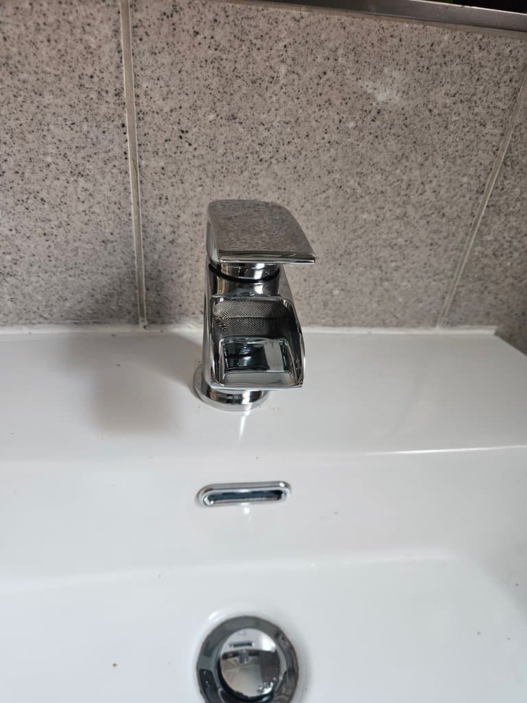 New chrome basin mixer tap fitted during a tap replacement in Torquay