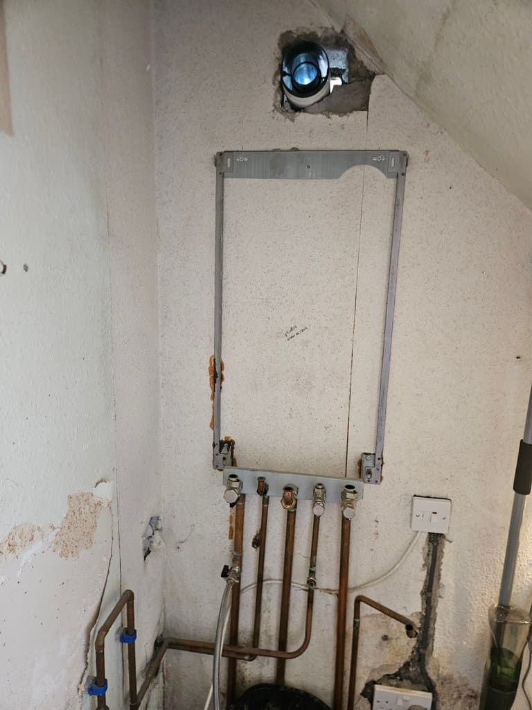 Wall after old Baxi boiler removed during boiler replacement in Torquay
