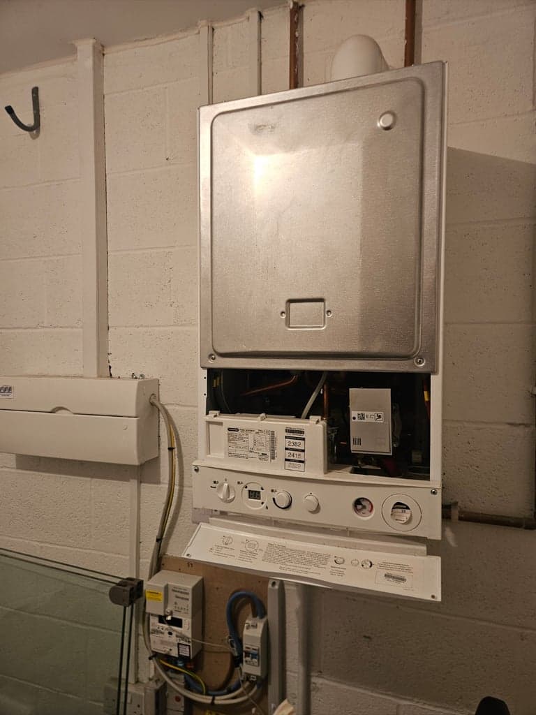 Potterton boiler opened for inspection during a garage boiler service in Totnes